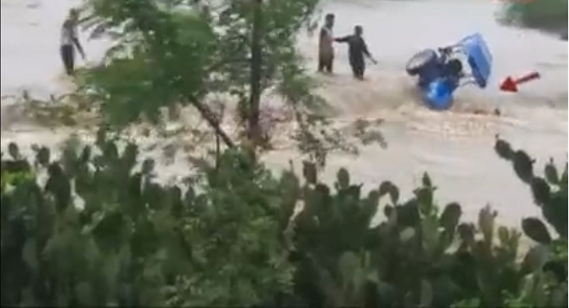 the-thunderous-form-of-the-clouds-the-rushing-water-swept-away-the-entire-tractor