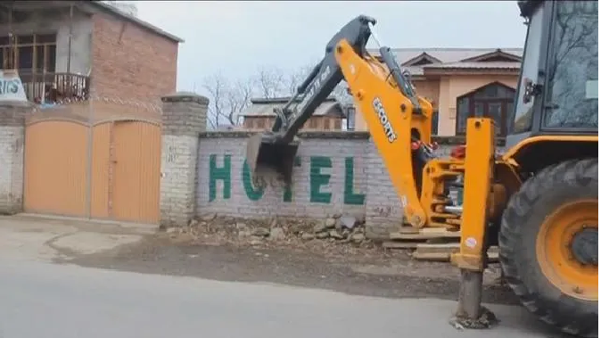 in-kashmir-a-bulldozer-was-used-on-the-terrorists-house-the-wall-was-demolished