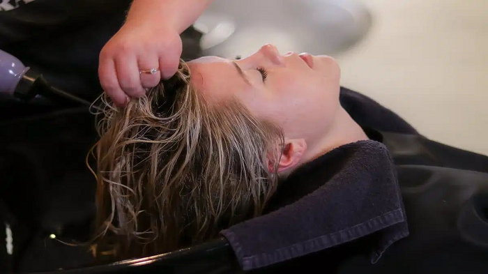 This woman flies to another country to get her hair cut because she is stingy, not rich